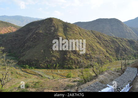 Scenery of beautiful Nepali rural village with mountains and green forest.It is in the hilly region of Panchthar Nepal.Breathtaking view,Dramatic and Stock Photo