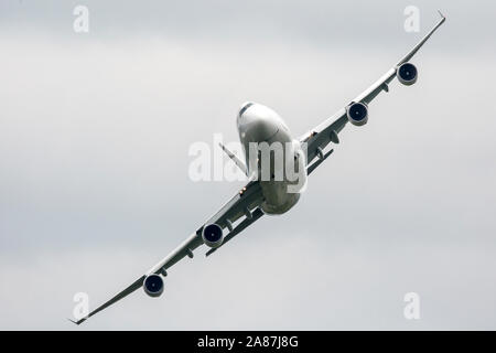 YPSILANTI, MICHIGAN / USA - August 25, 2018: A Boeing 747 owned by Kalitta Air performs a flyby at the 2018 Thunder Over Michigan Airshow.