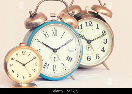 Three vintage alarm clock of different sizes Stock Photo