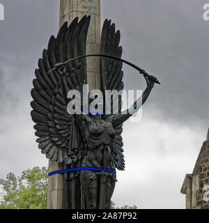 CHRISTCHURCH, CANTERBURY/NEW ZEALAND – JANUARY 30, 2016: [WW1 Memorial bronze angel statue restrained to keep her safe from tremors and aftershocks fr Stock Photo