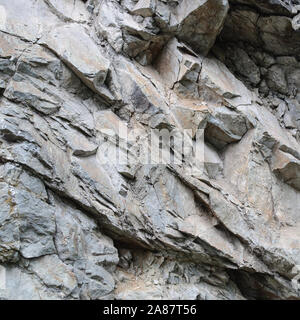 Close-up of abstract rock texture background with cracks and chips Stock Photo