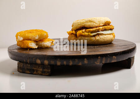 chicken sausage McMuffin with egg, and golden brown and crispy, hashbrowns - Image Stock Photo