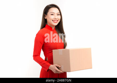 Happy chinese new year. Young woman holding gift box Stock Photo