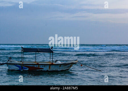 Colourful fishing boats in the hikkaduwa fishing harbour. traditional boating for sea ride Stock Photo