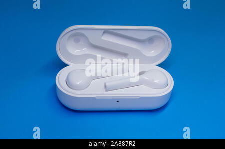 Wireless Bluetooth Earphone or Earbud. Air Pods wireless Bluetooth headphones. Stock Photo