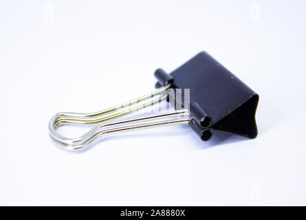 School stationery, Black paper clip isolated on white background, Stock Photo