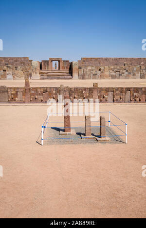 Semi-underground Temple with the Kalasasaya Temple and Ponce monolith shown in the background at Tiwanaku Archeological Complex, Bolivia Stock Photo