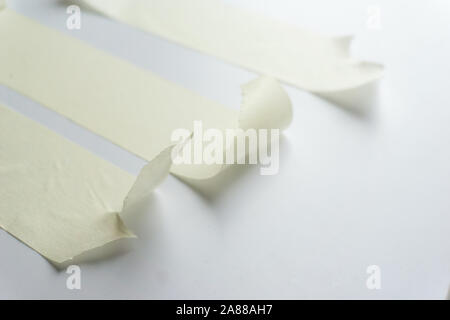 white adhesive tape on white background. close up shot. top view. Stock Photo