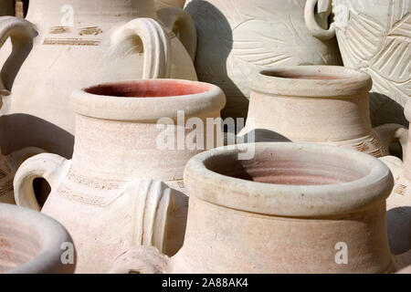 Traditional Tunisian Earthenware pots. Unglazed and unpainted pottery drying naturally in the warmth of the North Africa sun. Stock Photo