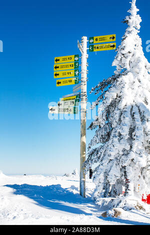 Kopaonik, Serbia - January 20, 2016: Ski resort, signpost giving directions to different ski slopes at alpine skiing areas in Kopaonik, Serbia Stock Photo