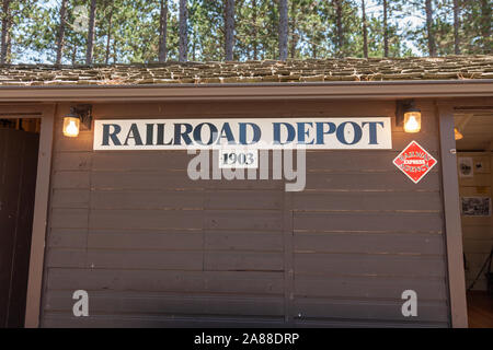 The old Railroad Depot, now a museum, built from logs in the Northwoods village of Boulder Junction, Wisconsin. Stock Photo