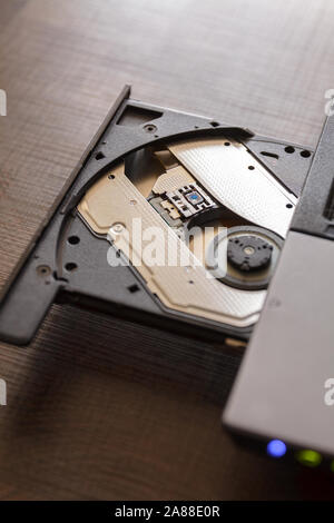Close-up optical drive on a laptop without a disk.Selective focus with shallow depth of field. Stock Photo