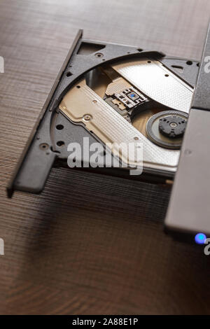 Close-up optical drive on a laptop without a disk.Selective focus with shallow depth of field. Stock Photo