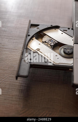 Close-up optical drive on a laptop without a disk.Selective focus with shallow depth of field. Stock Photo