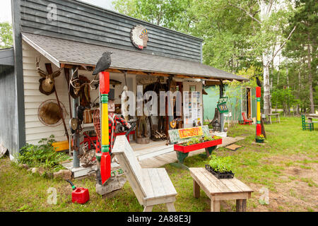 Wooden carving and taxidermy Muskie fish at a country store in the Northwoods village of Boulder Junction, Wisconsin. Stock Photo