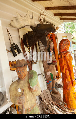 Wooden carving and taxidermy Moose at a country store in the Northwoods village of Boulder Junction, Wisconsin. Stock Photo