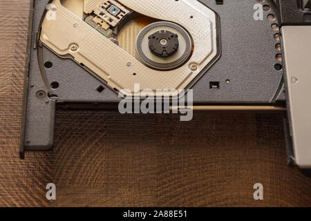 Close-up optical drive on a laptop without a disk.Selective focus with shallow depth of field. Stock Photo