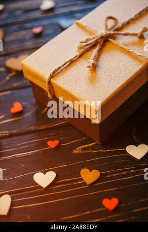 Decorative wooden hearts and a gift box Stock Photo