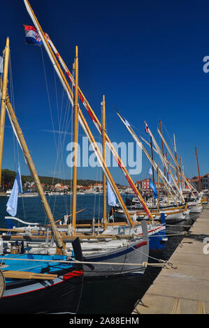 Moored old type sailing boats in the marine during sunny day Stock Photo