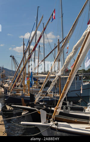 Moored old type sailing boats in the marine during sunny day Stock Photo