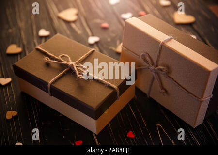 Two brown gift boxes on a wooden background Stock Photo