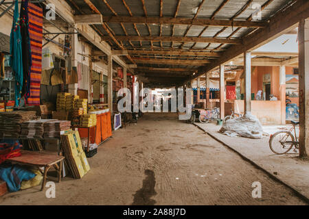 Rissani, Morocco - September 18th, 2019: Inside view of Rissani bazaar market, with stalls at both sides of a corridor, in Rissani, Morocco. Stock Photo