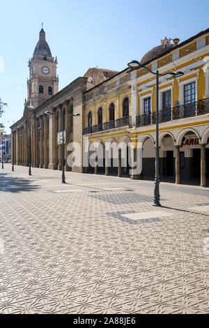 Colonial style buildings on 14 de Septiembre Square with the Metropolitan Cathedral of San Sebastian in the background in Cochabamba, Bolivia Stock Photo