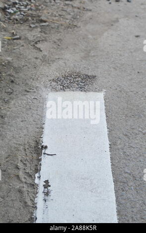 white border road line end on street Stock Photo