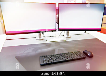Ergonomic workplace with keyboard and monitors concept Stock Photo