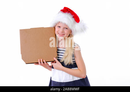 Christmas pizza and fastfood delivery.Blonde smiling girl in santa hat with pizza box in hands on white. Mock up for text or logo. Copyspace. Stock Photo