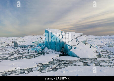 Aerial view of the J kuls rl n glacial lagoon and floating icebergs. The beginning of spring in Iceland. Stock Photo