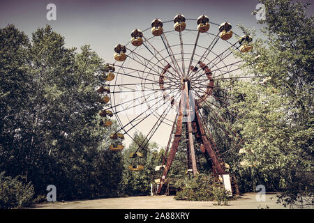 Ferris wheel in Pripyat, Ukraine. Chernobyl nuclear disaster, summer. Stock Photo