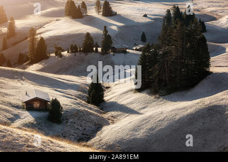 Misty landscape view in Alpe di Siusi or Seiser Alm at beautiful sunrise, Dolomites mountain, Italy Stock Photo