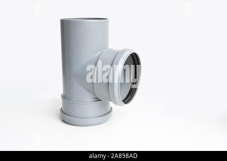 Plastic PVC pipes sewer fittings on a light background. Stock Photo