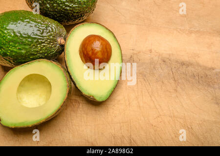 Avocados on wood Stock Photo