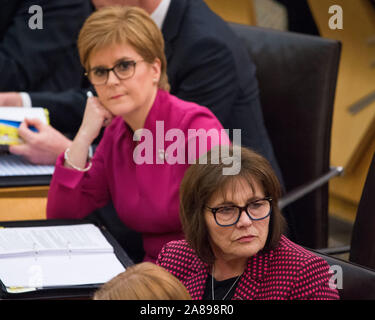 Edinburgh, UK. 7 November 2019. Pictured: (left) Nicola Sturgeon MSP - First Minister of Scotland and Leader of the Scottish National Party (SNP); (right), Jeane Freeman MSP - Cabinet Minister for Health, Scottish National Party (SNP).  Weekly session of First Ministers Questions in the chamber at Holyrood. Credit: Colin Fisher/Alamy Live News Stock Photo