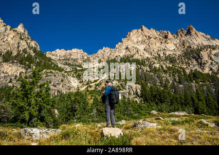 Senior man hiking on Sawtooth Mountains in Stanley, Idaho, USA Stock Photo