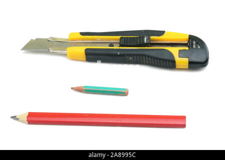 Clerical knife, big and small pencil, isolated on white background Stock Photo