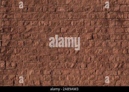 Detailed red brick wall background texture. Rough surface backdrop. Masonry of different stones. Old road texture. Large size image. Stock Photo