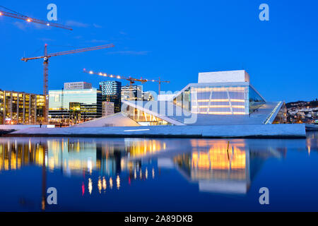 The Opera House, Norwegian National Opera and Ballet, by Snohetta architects in Bjorvika district, in the evening. Oslo, Norway Stock Photo