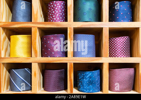 Colorful neckties arranged in a grid shelf Stock Photo
