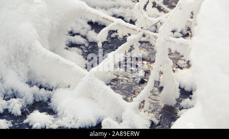 Winter Creek under snow cover Stock Photo