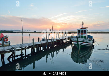 A fishing harbour on stilts. Carrasqueira at dusk. Alentejo, Portugal Stock Photo