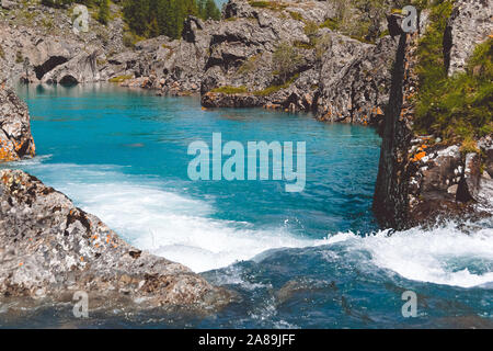 Mountain blue river in mountains. Sea rocks and turquoise sea. Sea voyage along coast. Stock Photo