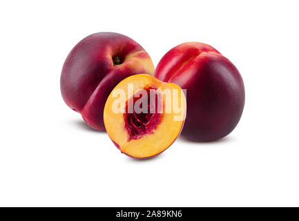 Two smooth-skinned, ripe nectarines and one half without kernel isolated on white background with copy space for text or images. Variety of peach. Sid Stock Photo