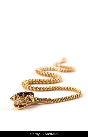 Victorian gold snake necklace with a garnet head, ruby eyes and diamond topknot. Stock Photo