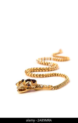 Victorian gold snake necklace with a garnet head, ruby eyes and diamond topknot. Stock Photo