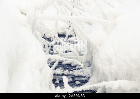 Winter Creek under snow cover Stock Photo