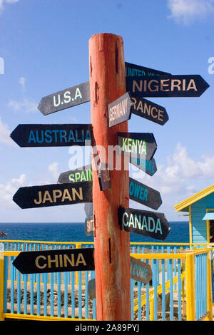 wooden signpost showing countries and distance, resort, Barbados Caribbean Stock Photo