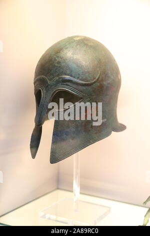 Bronze helmet of Corinthian type made in Apulia at the British Museum, London, UK Stock Photo